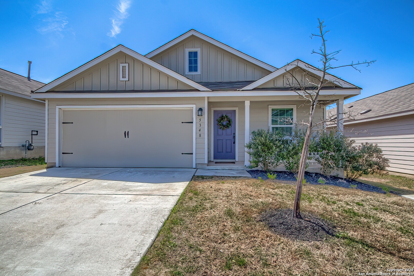 5348 Fair Moon Drive Bulverde, TX 78163 - Photo 1 of 1 a front view of a house with a yard and garage