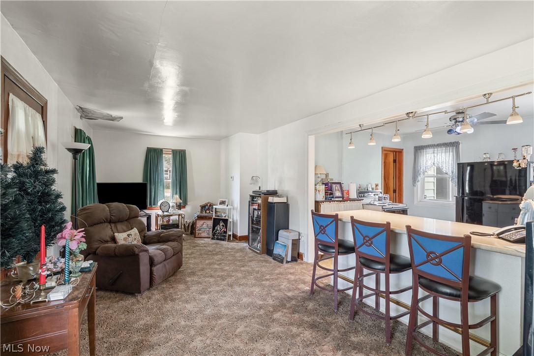 6324 Struthers Road Youngstown, OH 44514 - Photo 20 of 42 Open concept living area featuring a breakfast bar with seating for three