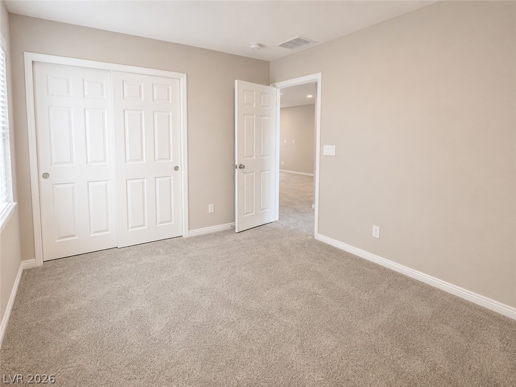 8768 Rio Andir Avenue Las Vegas, NV 89148 - Photo 5 of 9 Ample closet space complements this naturally lit, cozy bedroom ready for personal touches.