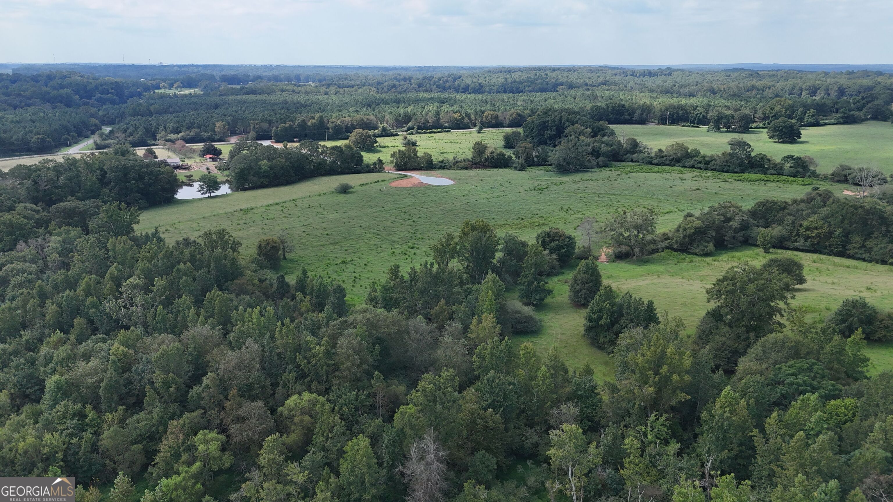 9 Red Rose Road Nicholson, GA 30565 - Photo 48 of 65 an aerial view of green landscape with trees houses and mountain view