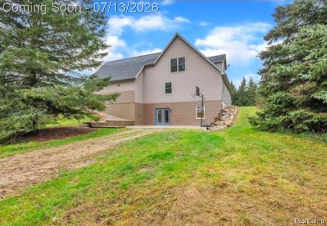 12601 Angle Road Bath, MI 48808 - Photo 2 of 2 Two-tone exterior with a gabled roofline