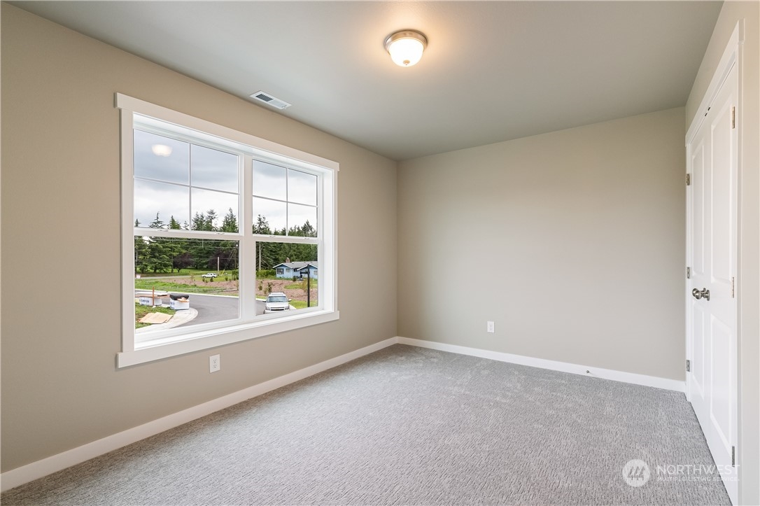6929 Red Ridge Drive, Unit B Lynden, WA 98264 - Photo 22 of 28 an empty room with windows