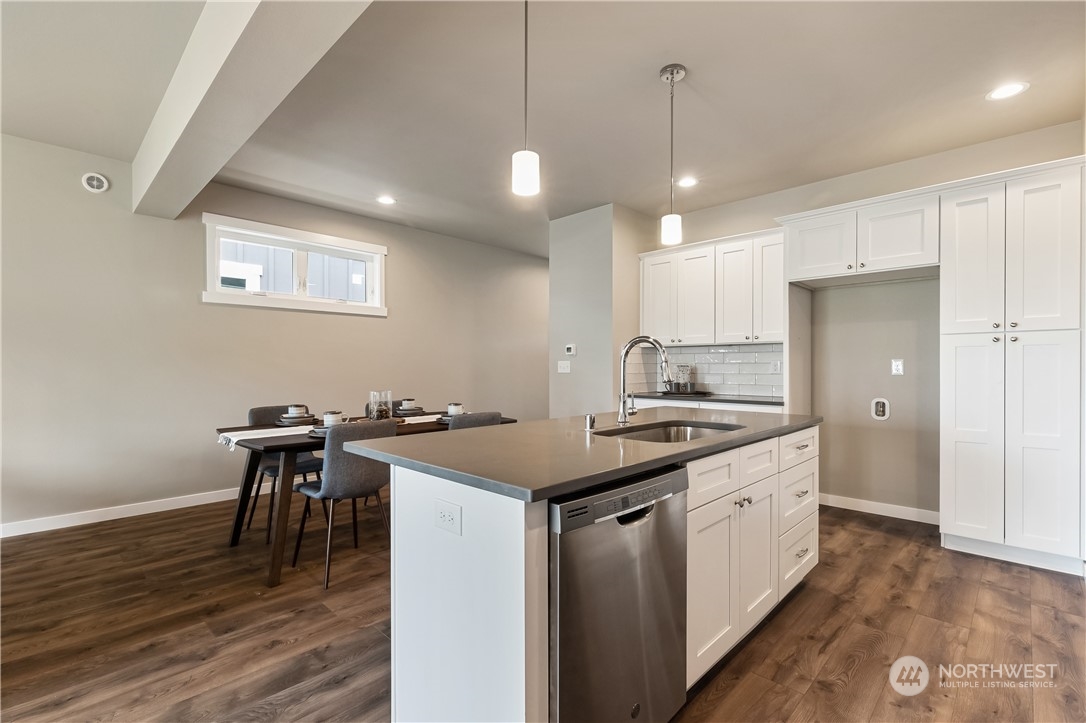 6929 Red Ridge Drive, Unit B Lynden, WA 98264 - Photo 8 of 28 a kitchen with kitchen island a sink stove and wooden floor