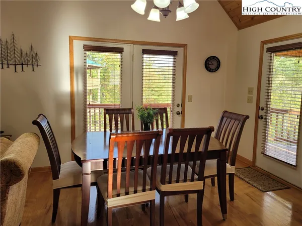 a kitchen with stainless steel appliances granite countertop a refrigerator a sink a stove and island
