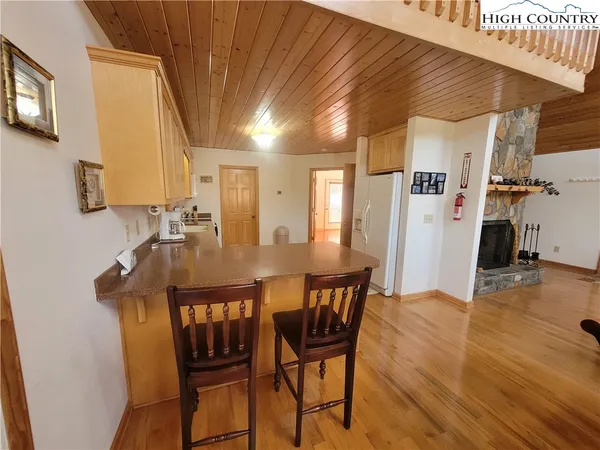 a kitchen with a stove a sink and a refrigerator