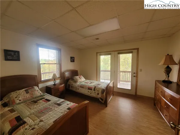 a bedroom with furniture and a window