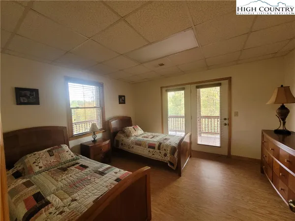 a bedroom with furniture and a window