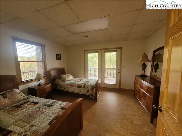 a bedroom with furniture and a window