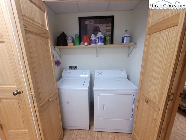 a bedroom with a bed and a night stand