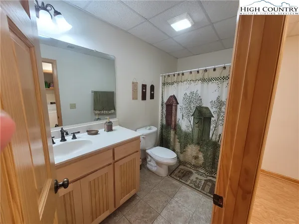 a bathroom with a double vanity sink and mirror