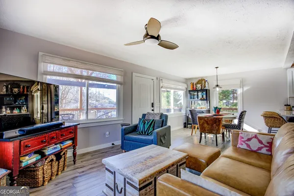 a kitchen with stainless steel appliances a stove a sink and a microwave