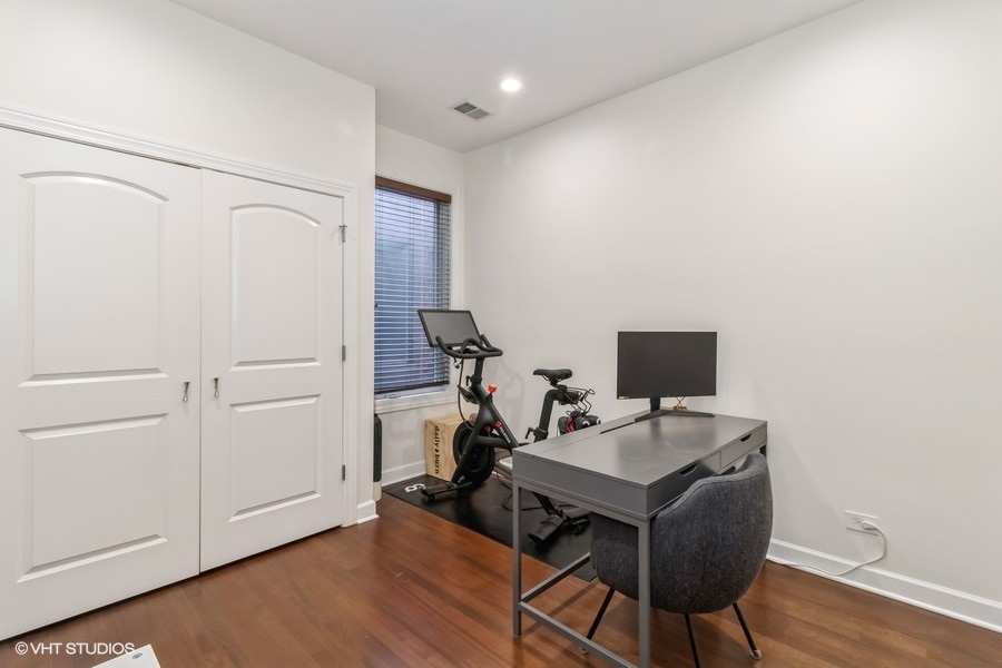 2122 West Rice Street, Unit 4 Chicago, IL 60622 - Photo 15 of 22 a view of a workspace with furniture and wooden floor