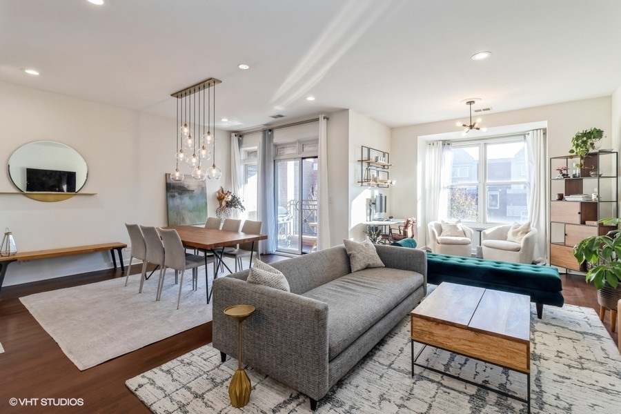 2122 West Rice Street, Unit 4 Chicago, IL 60622 - Photo 2 of 22 a living room with furniture and a large window
