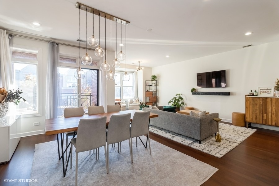 2122 West Rice Street, Unit 4 Chicago, IL 60622 - Photo 3 of 22 a living room with fireplace furniture and a flat screen tv