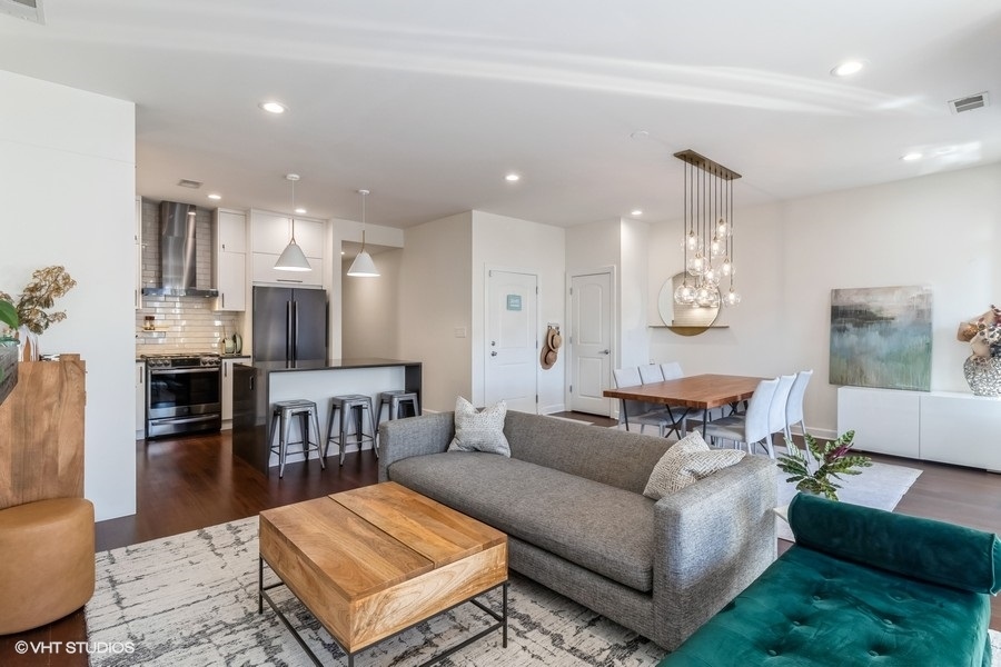 2122 West Rice Street, Unit 4 Chicago, IL 60622 - Photo 4 of 22 a living room with furniture and a kitchen view