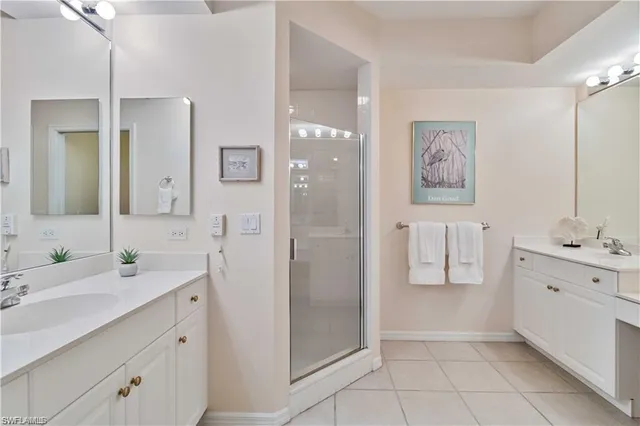 a spacious bathroom with a double vanity sink mirror and double