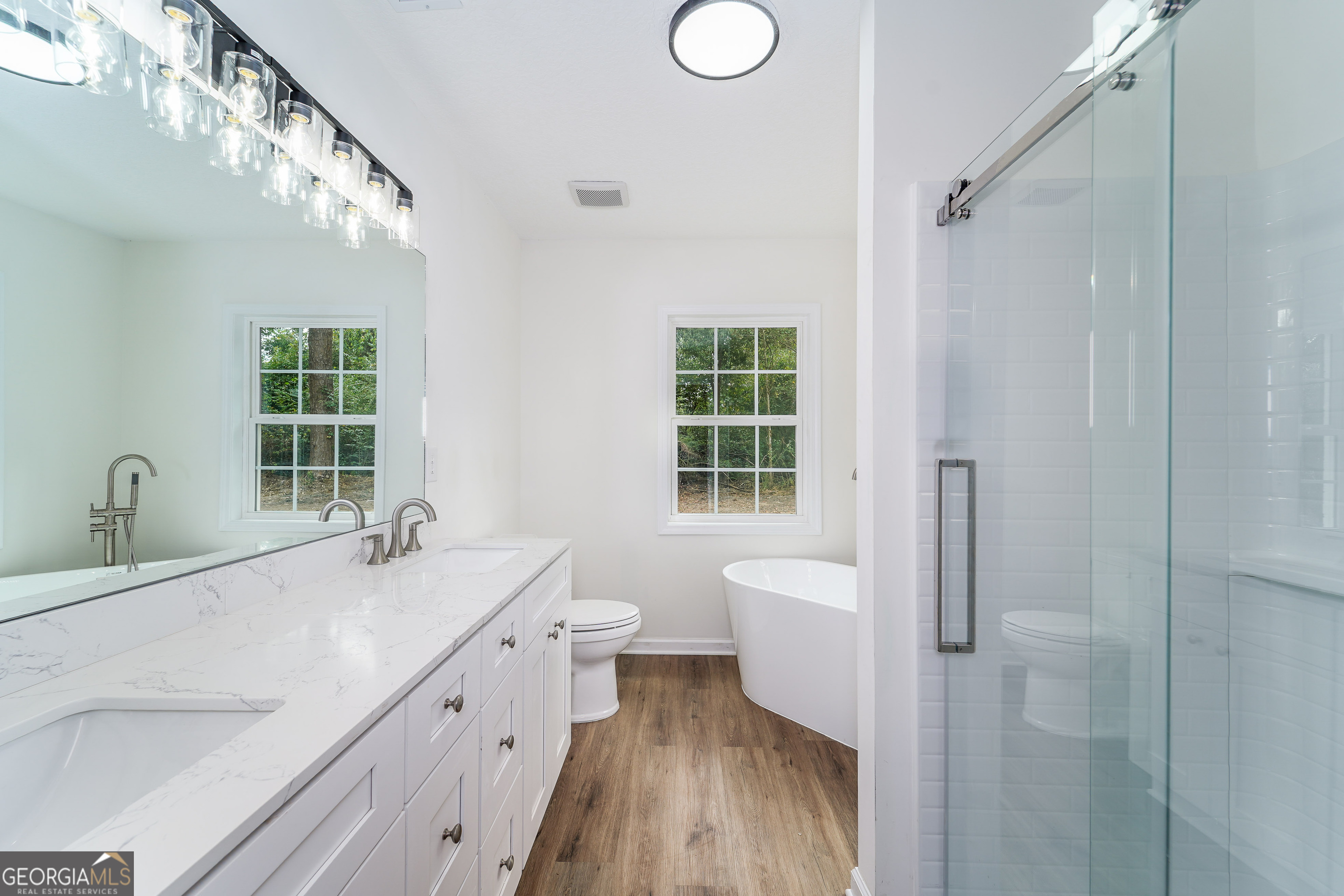 3551 Cason Road Blackshear, GA 31516 - Photo 12 of 24 a bathroom with a sink a toilet and shower