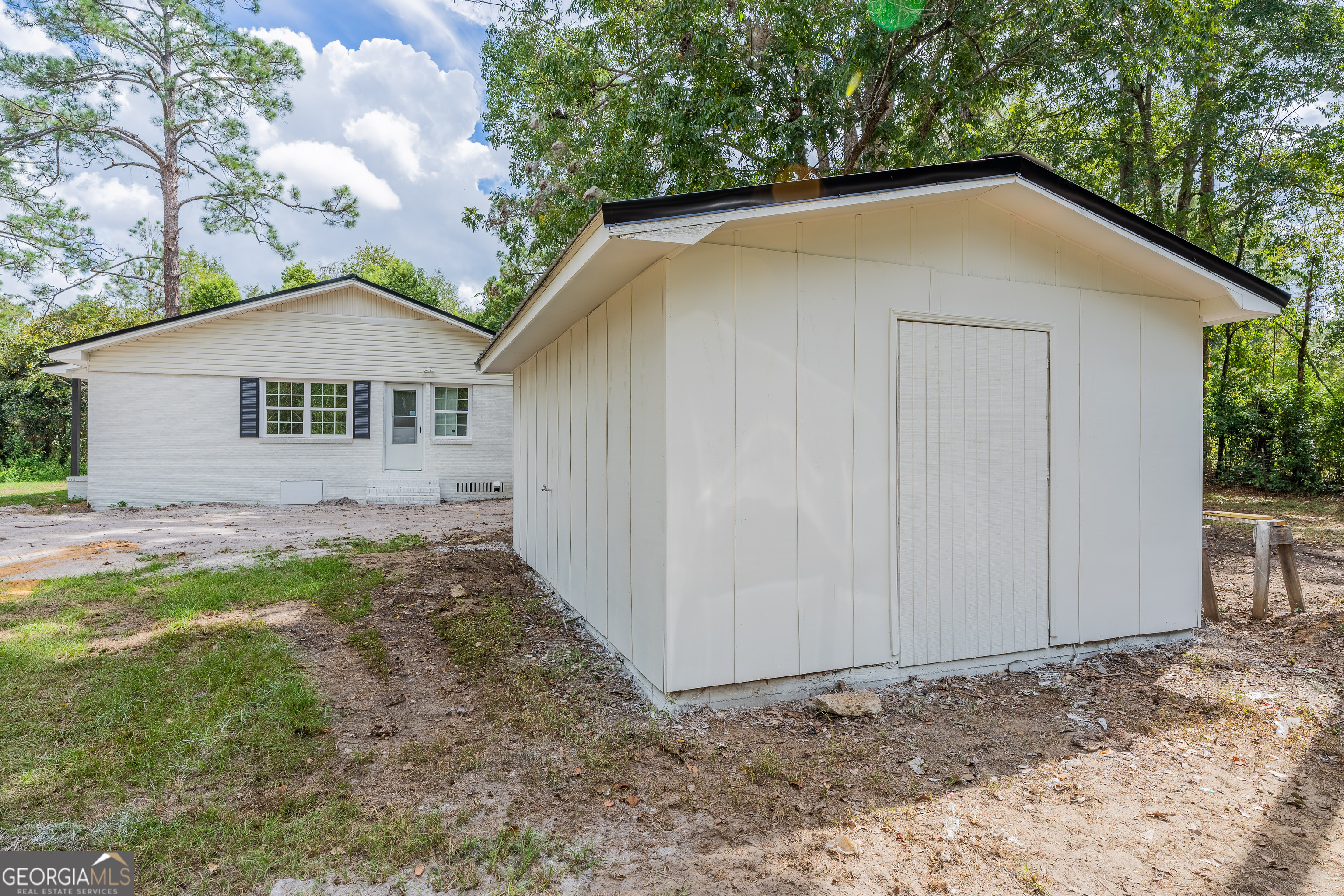3551 Cason Road Blackshear, GA 31516 - Photo 21 of 24 a house with trees in the background