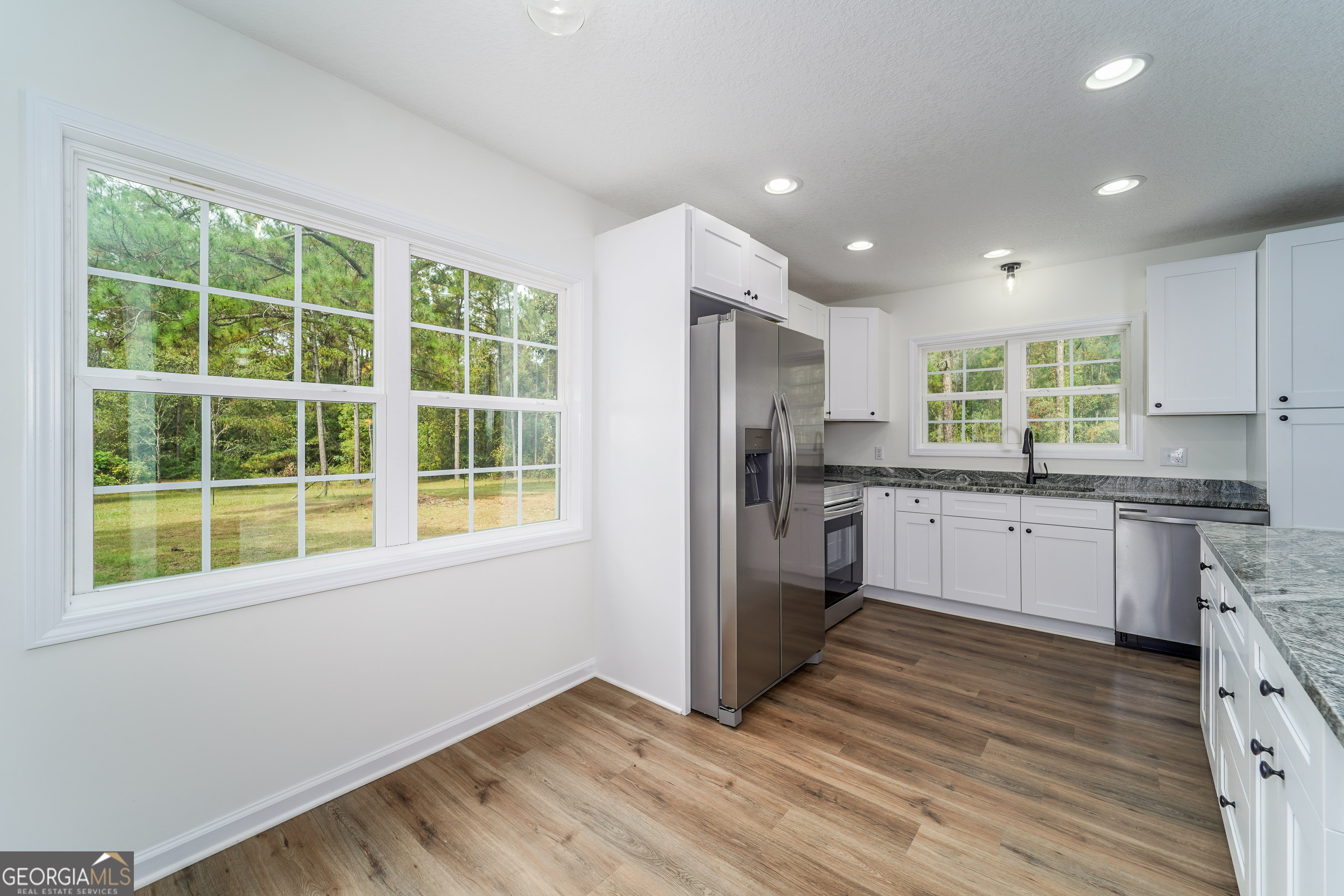 3551 Cason Road Blackshear, GA 31516 - Photo 10 of 24 a kitchen with a refrigerator and window