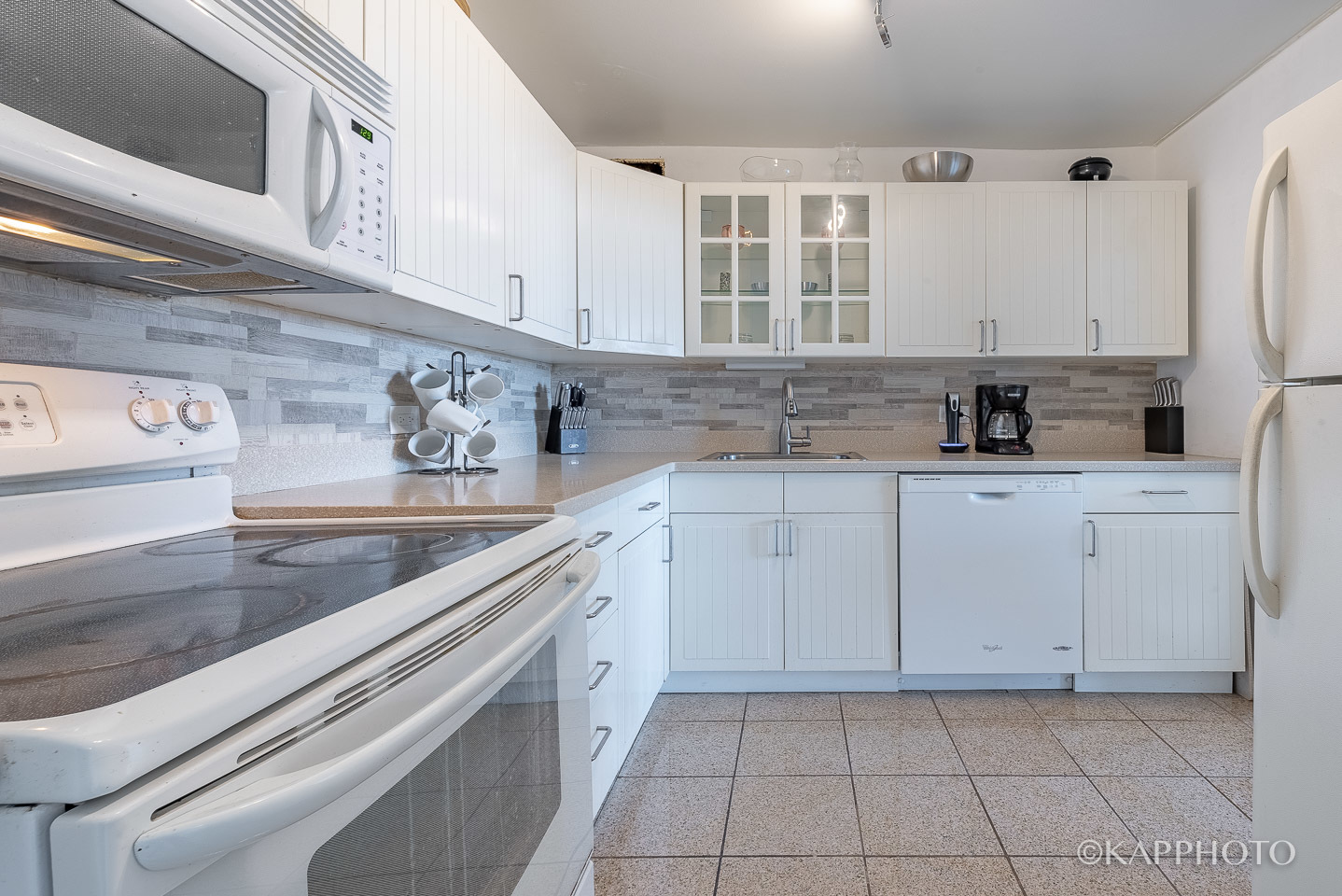3930 North Pine Grove Avenue, Unit 2005 Chicago, IL 60613 - Photo 12 of 20 a kitchen with a sink and cabinets