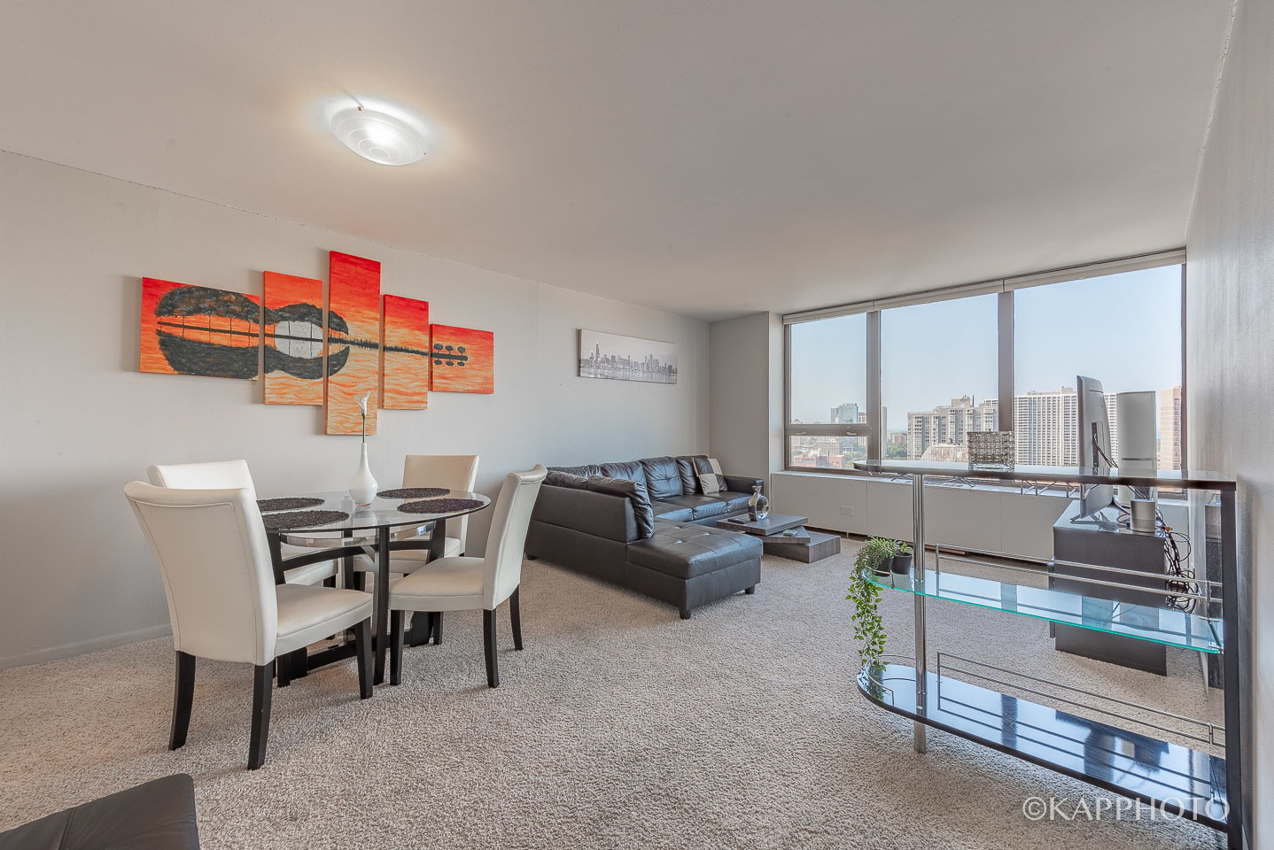 3930 North Pine Grove Avenue, Unit 2005 Chicago, IL 60613 - Photo 14 of 20 a living room with furniture and a floor to ceiling window