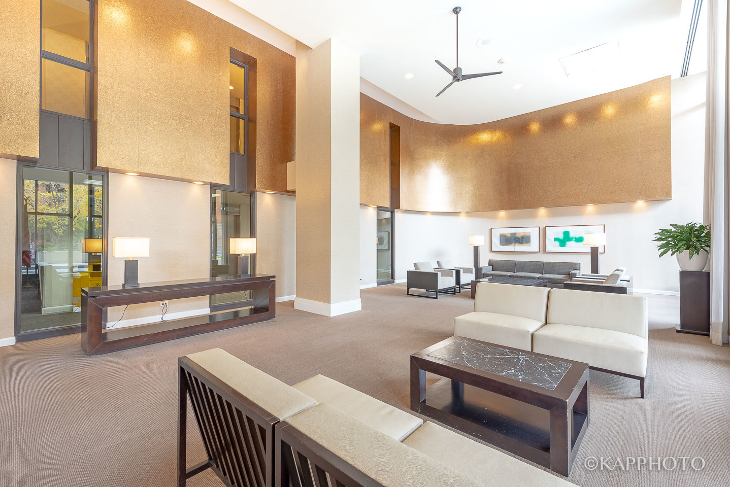 3930 North Pine Grove Avenue, Unit 2005 Chicago, IL 60613 - Photo 2 of 20 a living room with furniture a large window and a potted plant