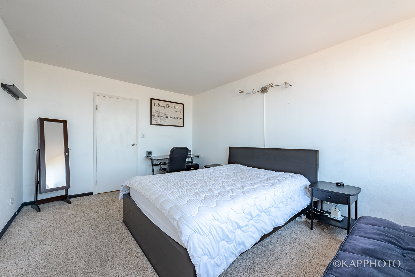 3930 North Pine Grove Avenue, Unit 2005 Chicago, IL 60613 - Photo 8 of 20 a bedroom with a bed and a table in it