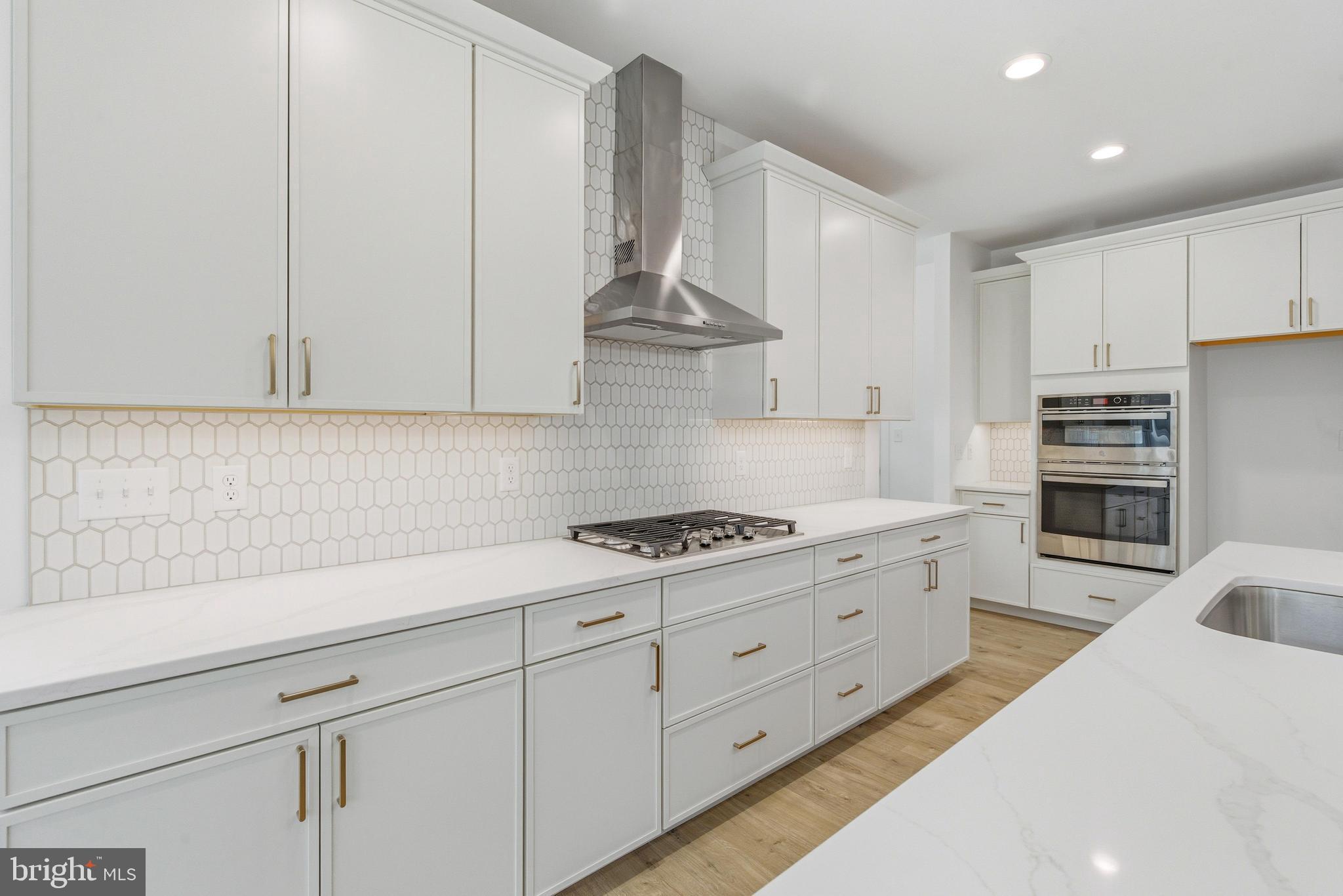 1050 Glen Hall Road Kennett Square, PA 19348 - Photo 11 of 42 a kitchen with granite countertop white cabinets and stainless steel appliances