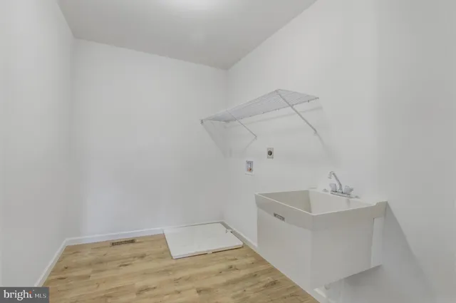 a bathroom with a sink and vanity