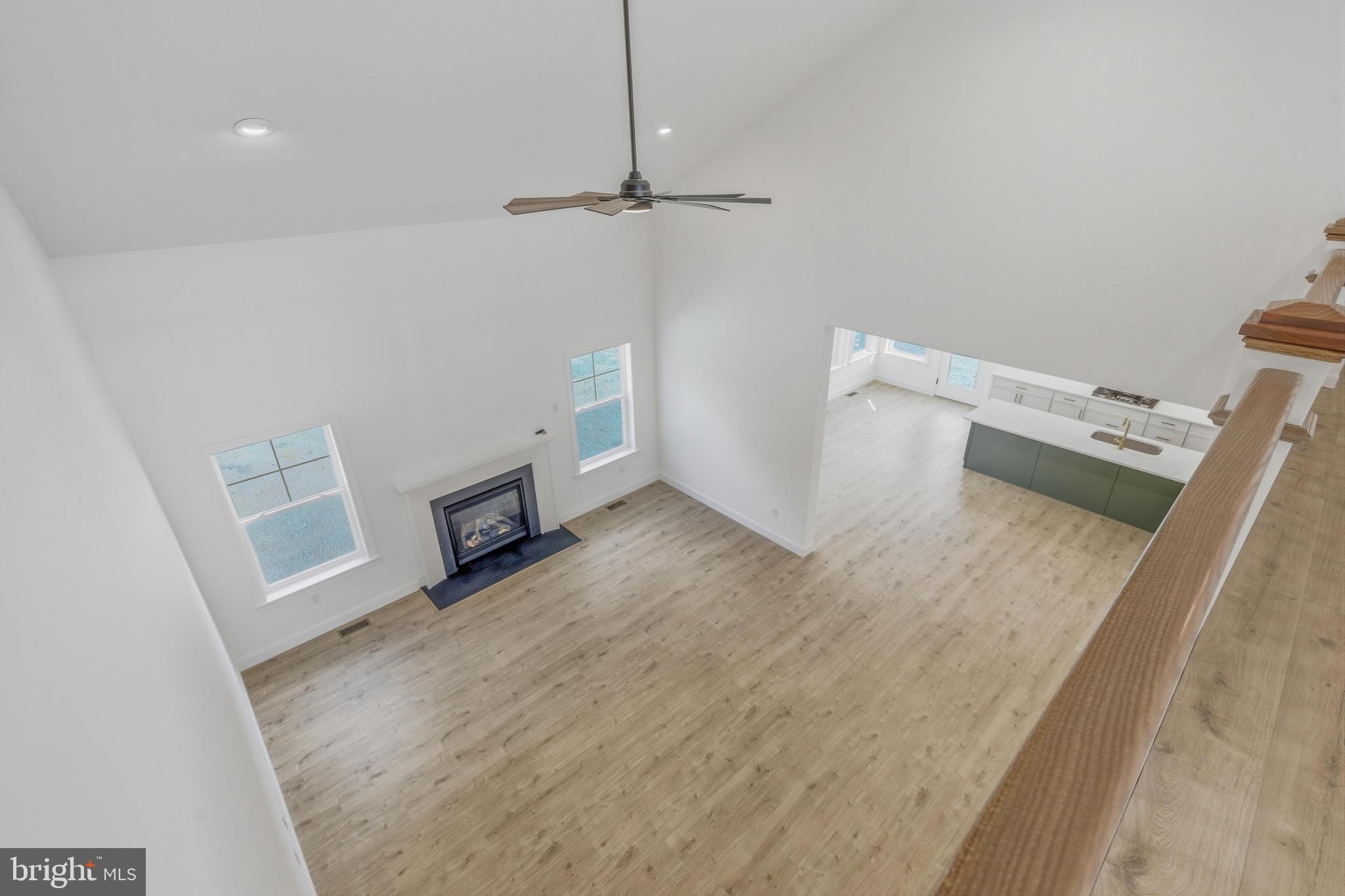 1050 Glen Hall Road Kennett Square, PA 19348 - Photo 21 of 42 wooden floor in an empty room with a fireplace