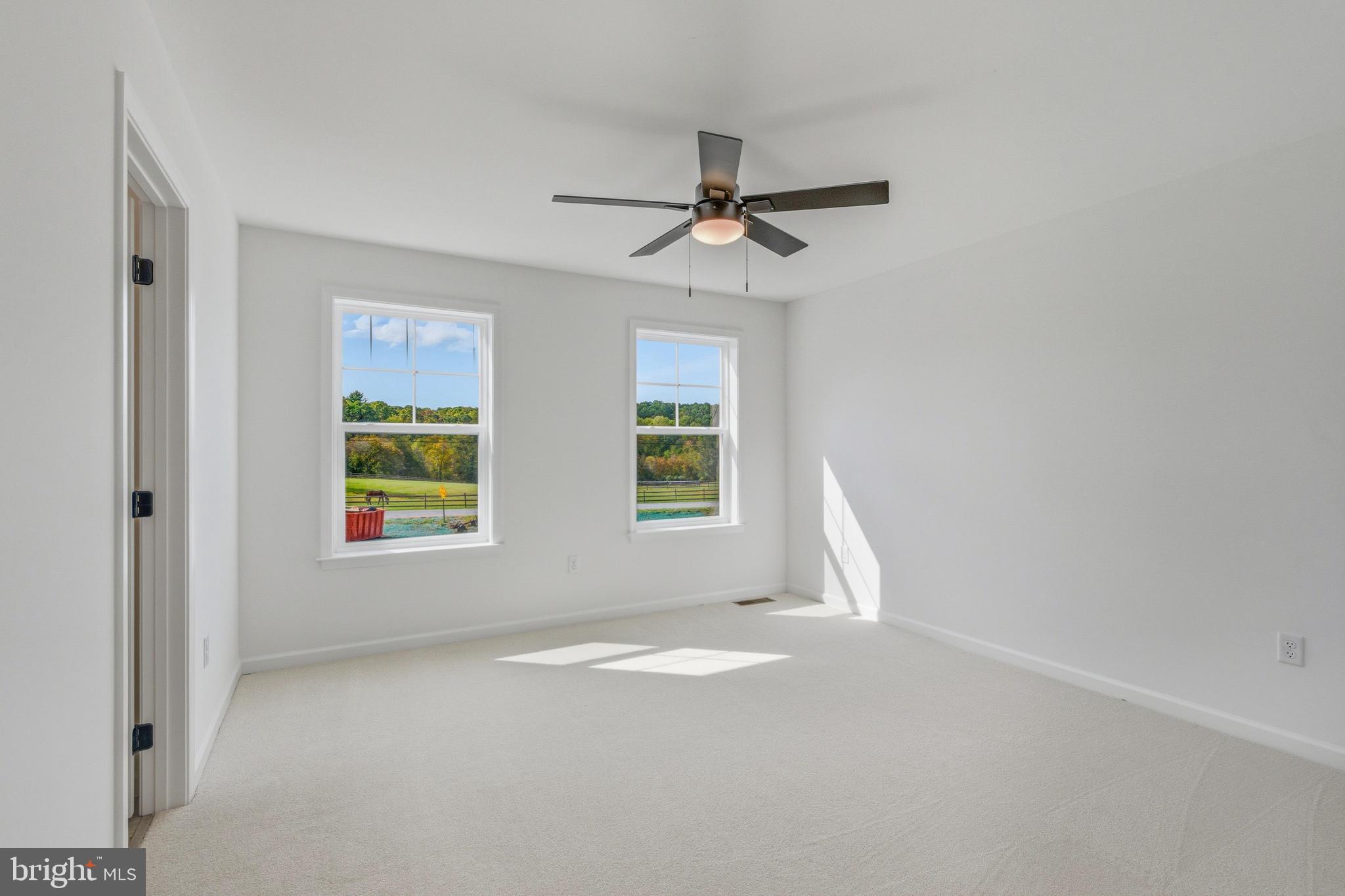 1050 Glen Hall Road Kennett Square, PA 19348 - Photo 37 of 42 an empty room with windows and fan