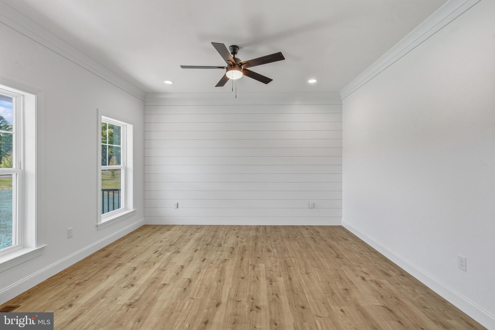 1050 Glen Hall Road Kennett Square, PA 19348 - Photo 6 of 42 a view of empty room with wooden floor and fan