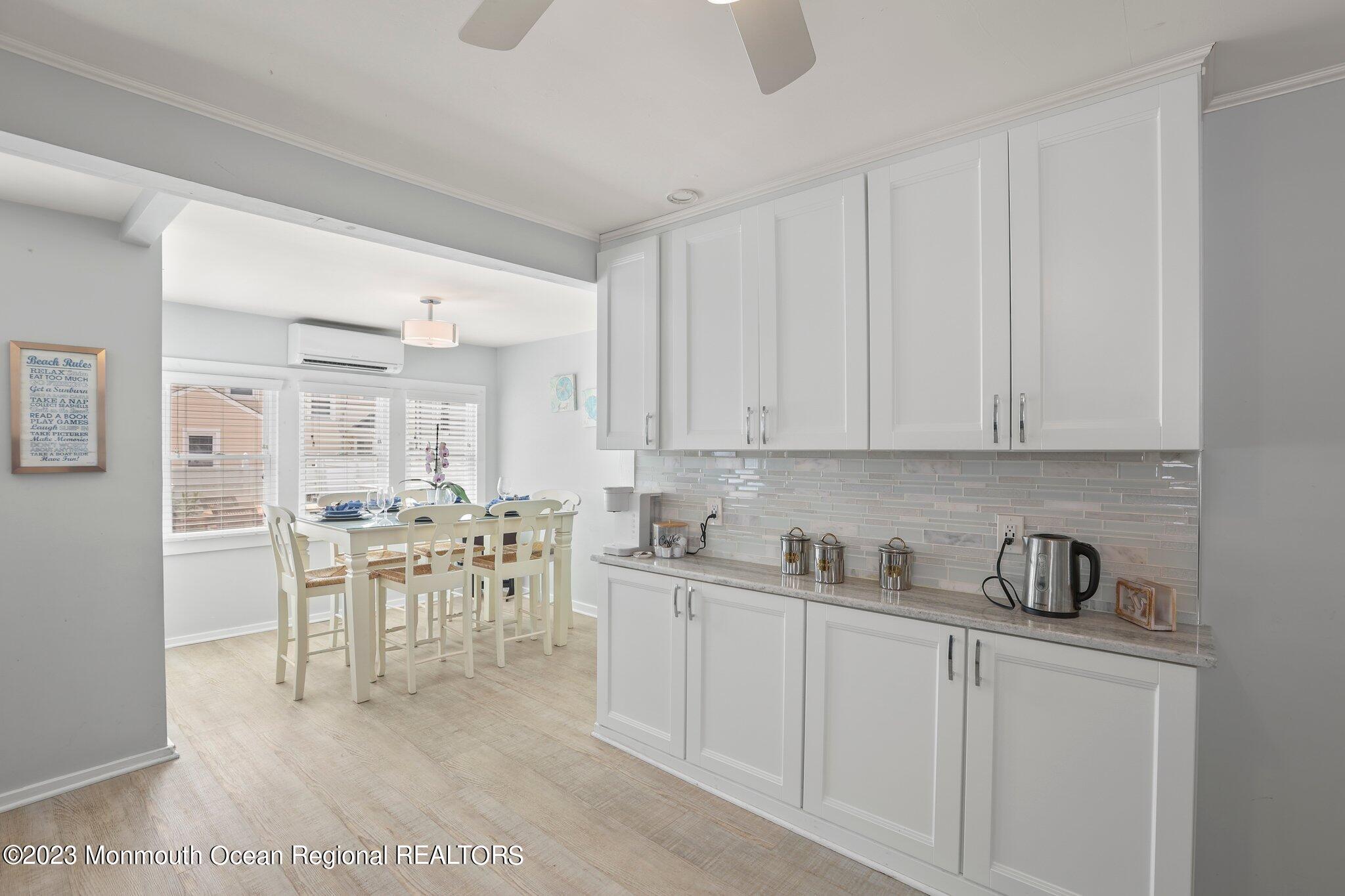 107 17th Avenue Belmar, NJ 07719 - Photo 15 of 32 a kitchen with a sink and cabinets