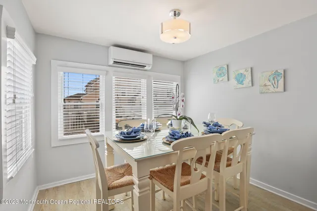 a dining room with furniture and window