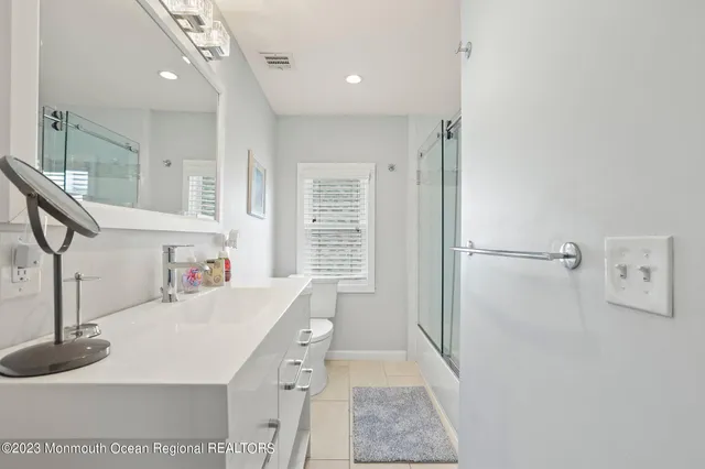 a kitchen with a sink a refrigerator and a stove