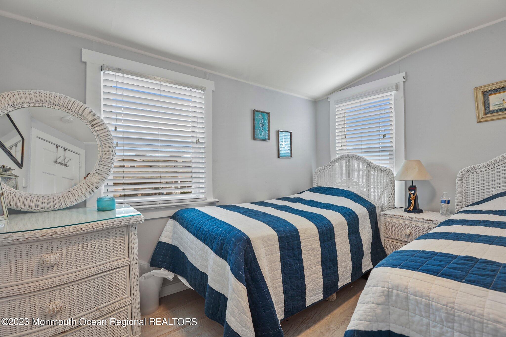 107 17th Avenue Belmar, NJ 07719 - Photo 19 of 32 a bedroom with bed and a window