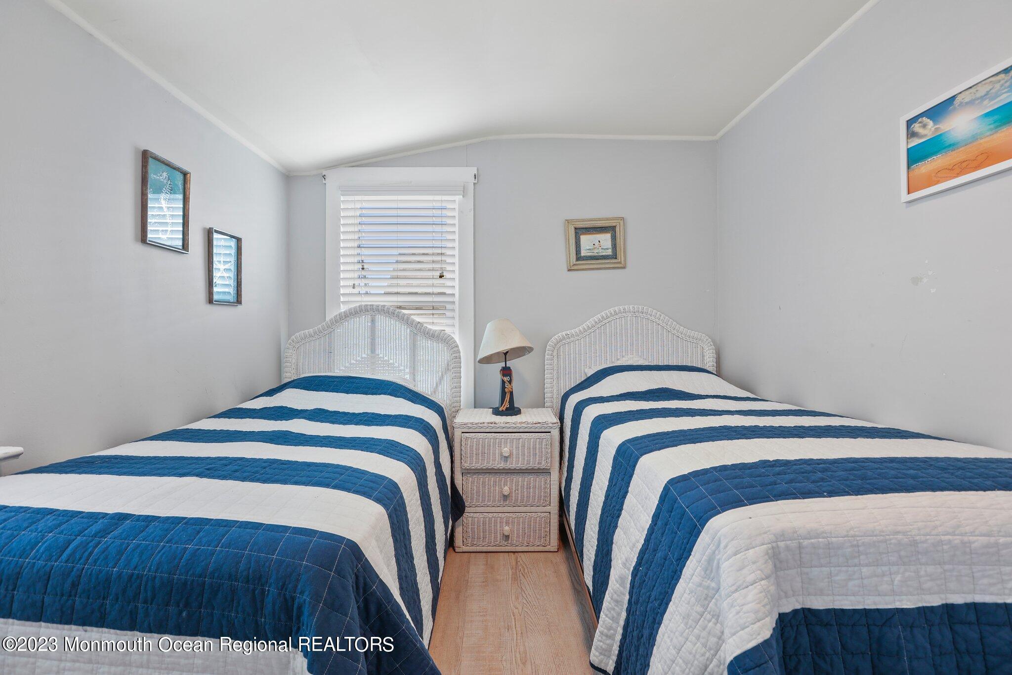 107 17th Avenue Belmar, NJ 07719 - Photo 20 of 32 a bedroom with bed and a window