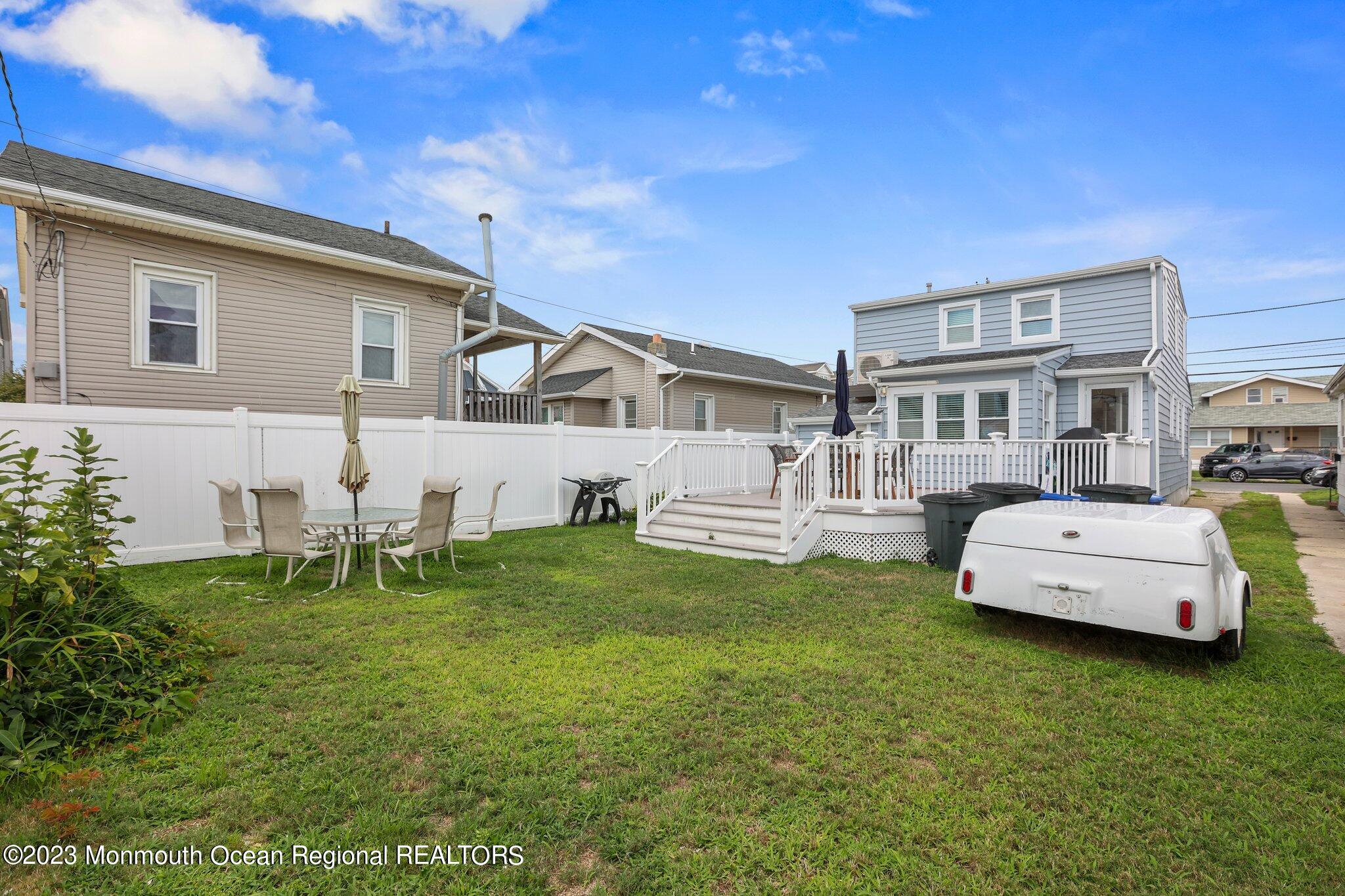 107 17th Avenue Belmar, NJ 07719 - Photo 26 of 32 a front view of a house with a garden and patio