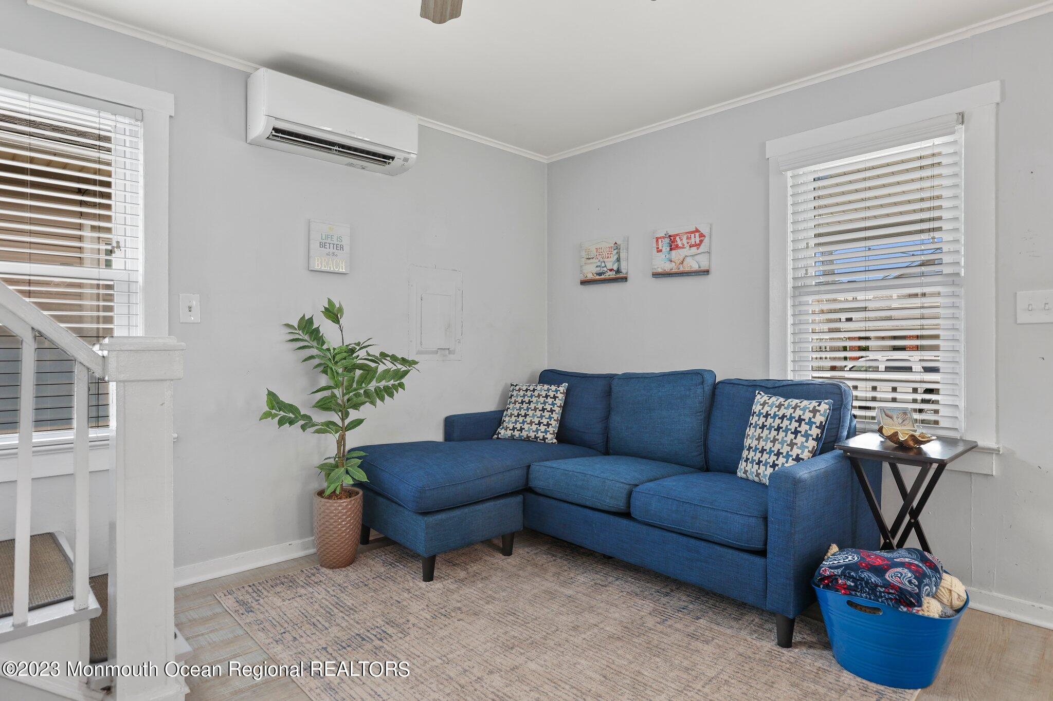 107 17th Avenue Belmar, NJ 07719 - Photo 9 of 32 a living room with furniture and a potted plant