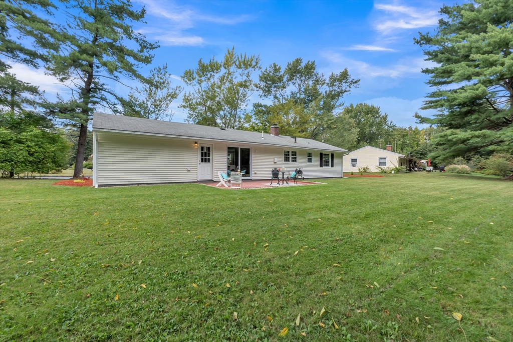 33 Ruthellen Road Framingham, MA 01701 - Photo 42 of 42 a front view of house with yard and trees in the background