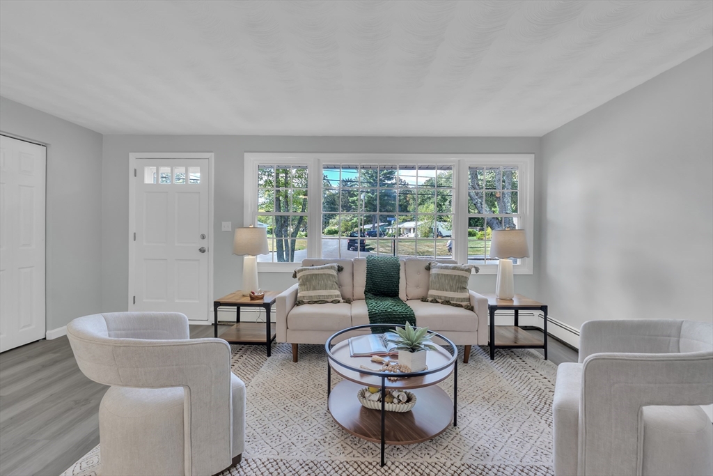 33 Ruthellen Road Framingham, MA 01701 - Photo 6 of 42 a living room with furniture and a large window