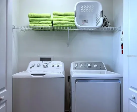 a utility room with dryer and washer