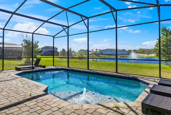 a view of a swimming pool with a lounge chairs
