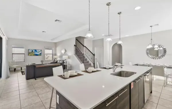 a kitchen with a sink a counter top space and appliances