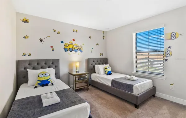 a bedroom with a bed and a couch