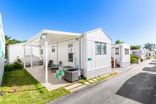 a front view of a house with outdoor seating