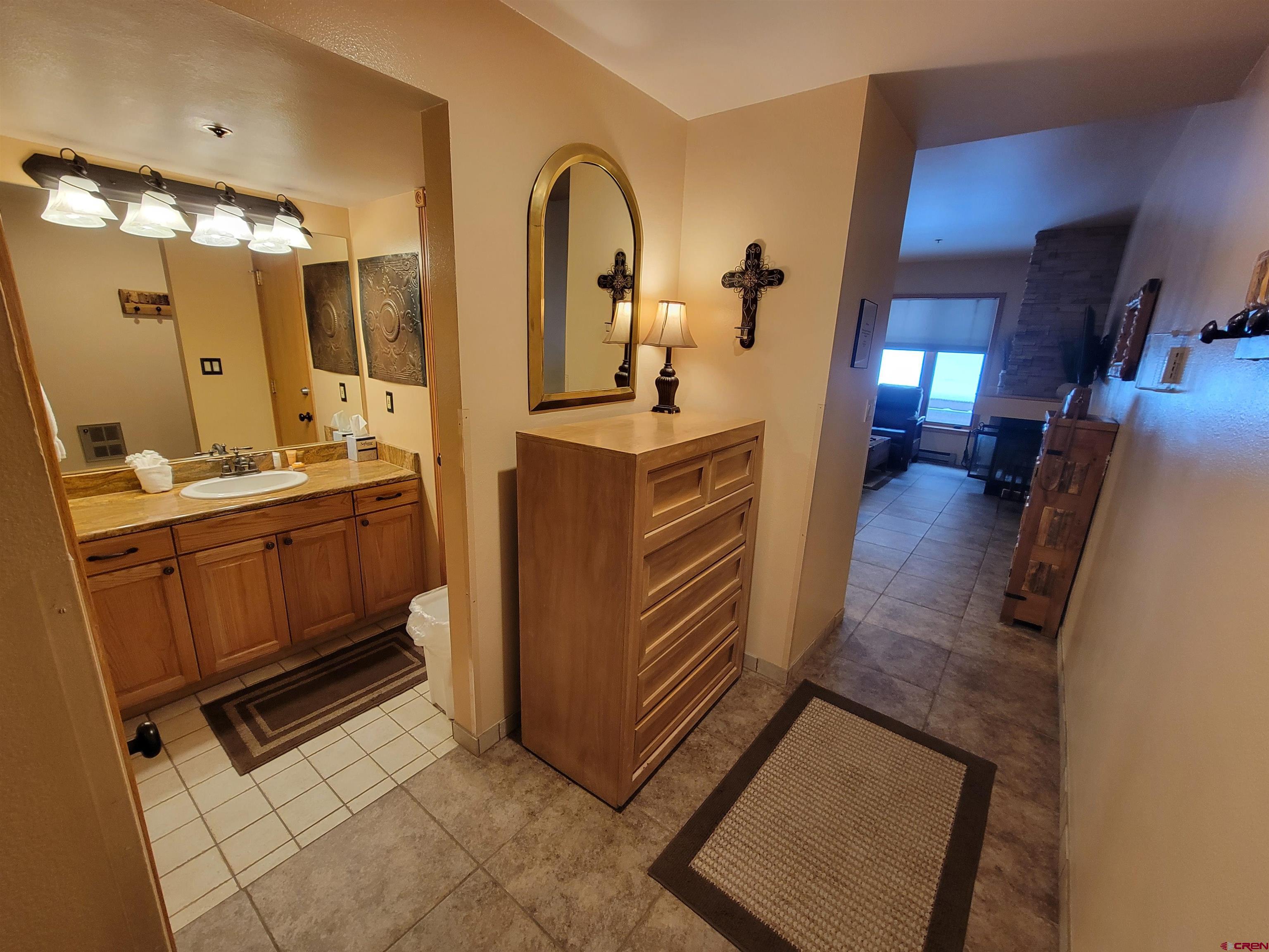 71 Needles Way, Unit 347 Durango, CO 81301 - Photo 13 of 31 a kitchen with a sink and a refrigerator