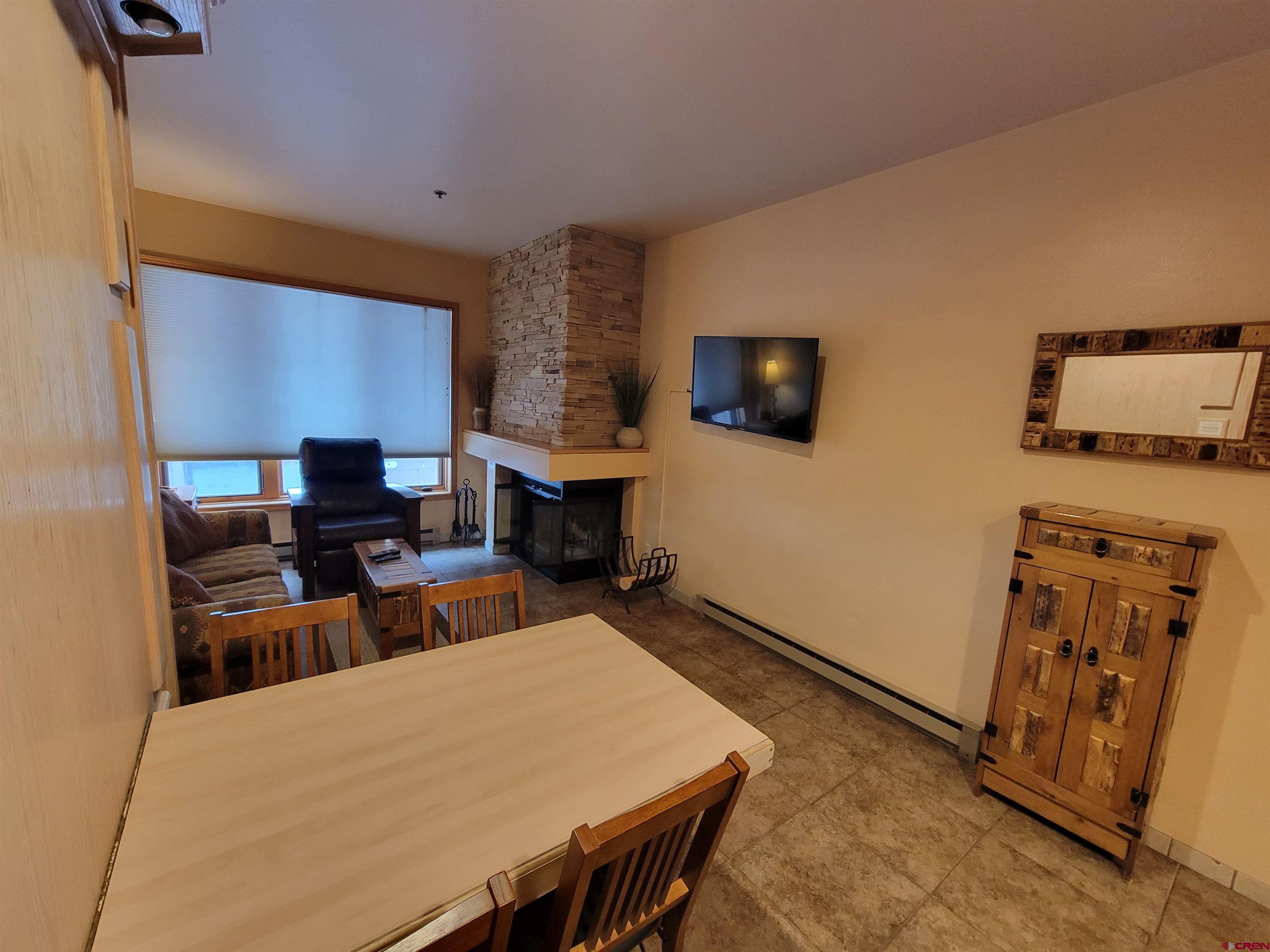 71 Needles Way, Unit 347 Durango, CO 81301 - Photo 17 of 31 a bed room with a bed and a television