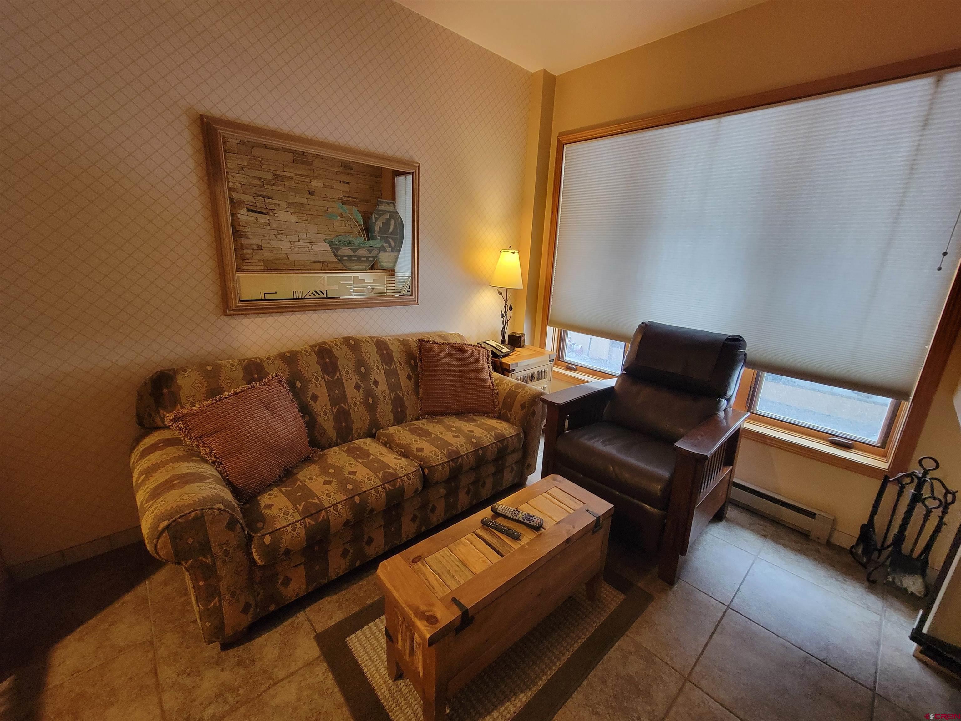 71 Needles Way, Unit 347 Durango, CO 81301 - Photo 19 of 31 a living room with furniture and a couch