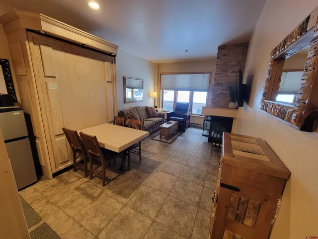 a living room with furniture and a table